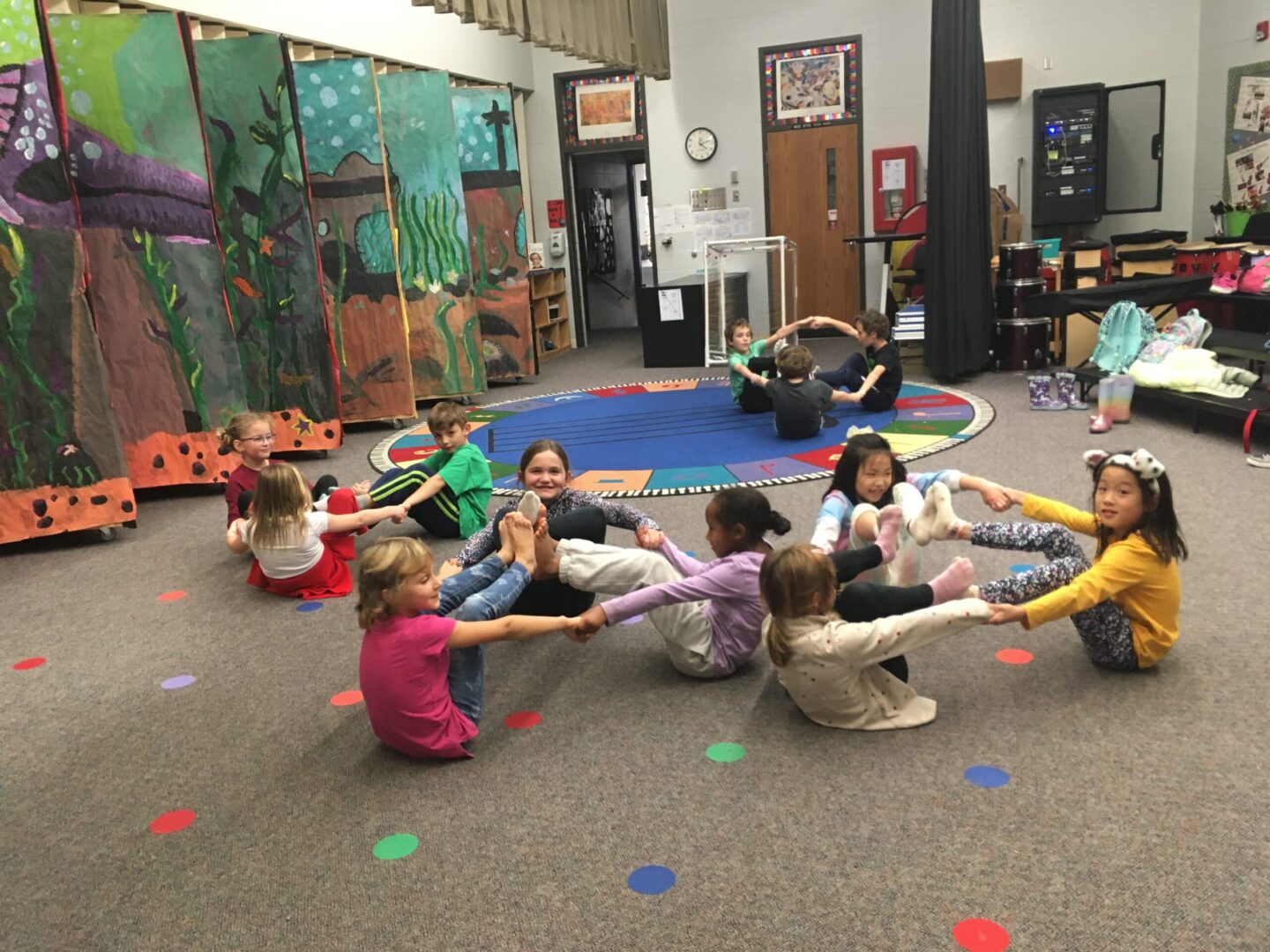 Circle with feet and hands during yoga class for children